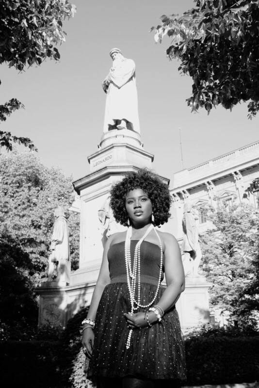 Editorial press portrait of Jemiriye — Heritage × Modernity (Milan, before Leonardo), Yoruba heritage meets European modernity