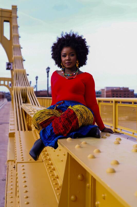 Jemiriye in vibrant Ankara streetwear — Color & Movement, bold contemporary Afro-fusion artist available for booking